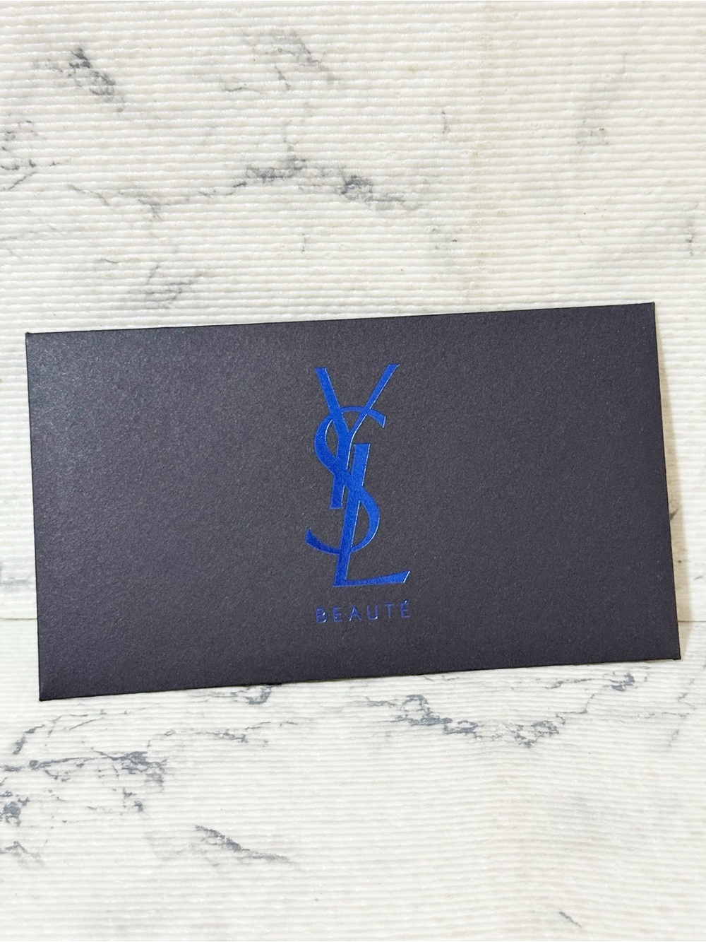 YSL Beauty Black Envelope With Metallic Blue Logo